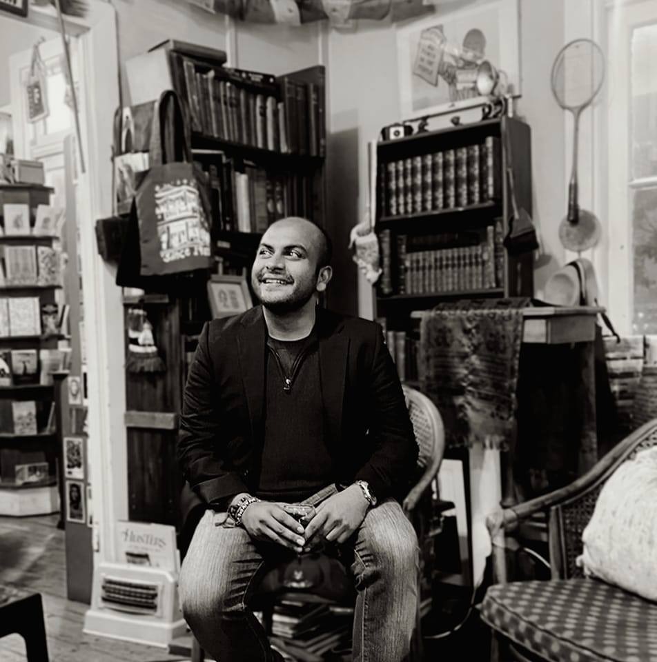 Dayakar Padayachee, South African filmmaker, writer and author, photographed in a bookshop