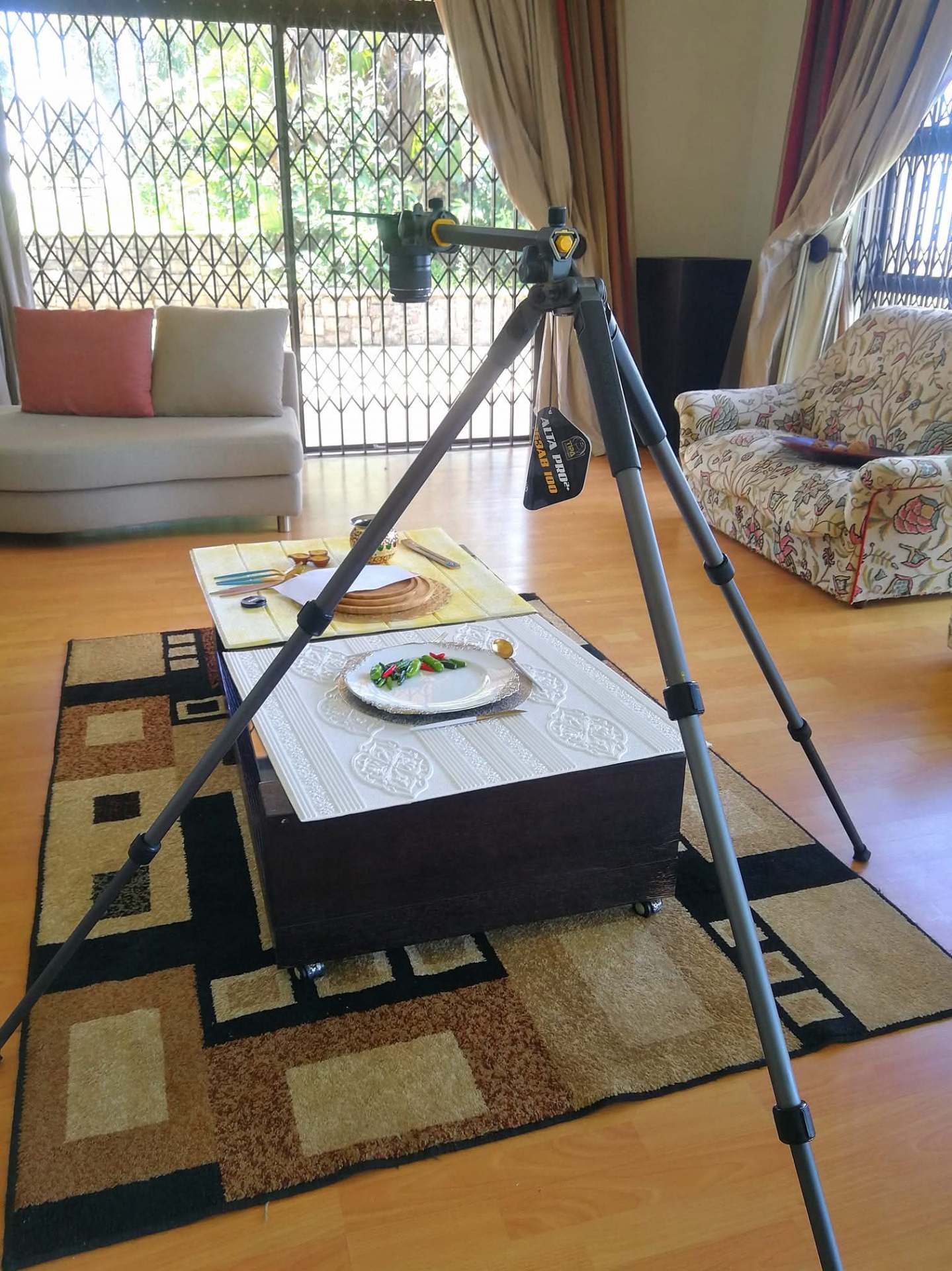 Overhead rigs and coffee-table sets — chasing the perfect light at home.